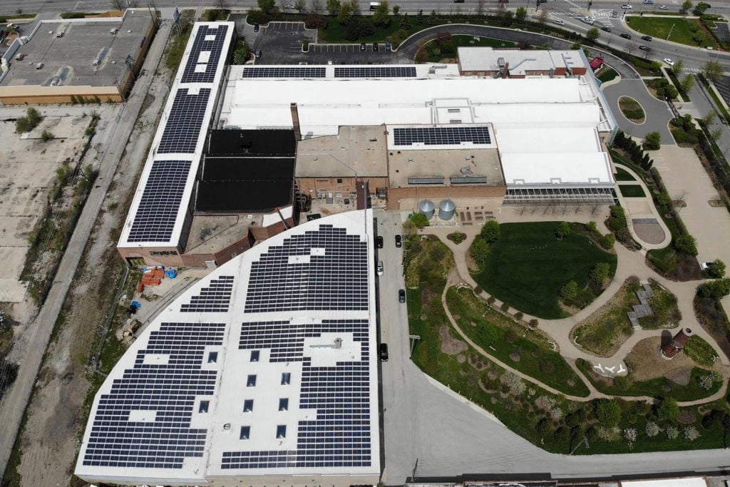 Solar panels on a large building's roof